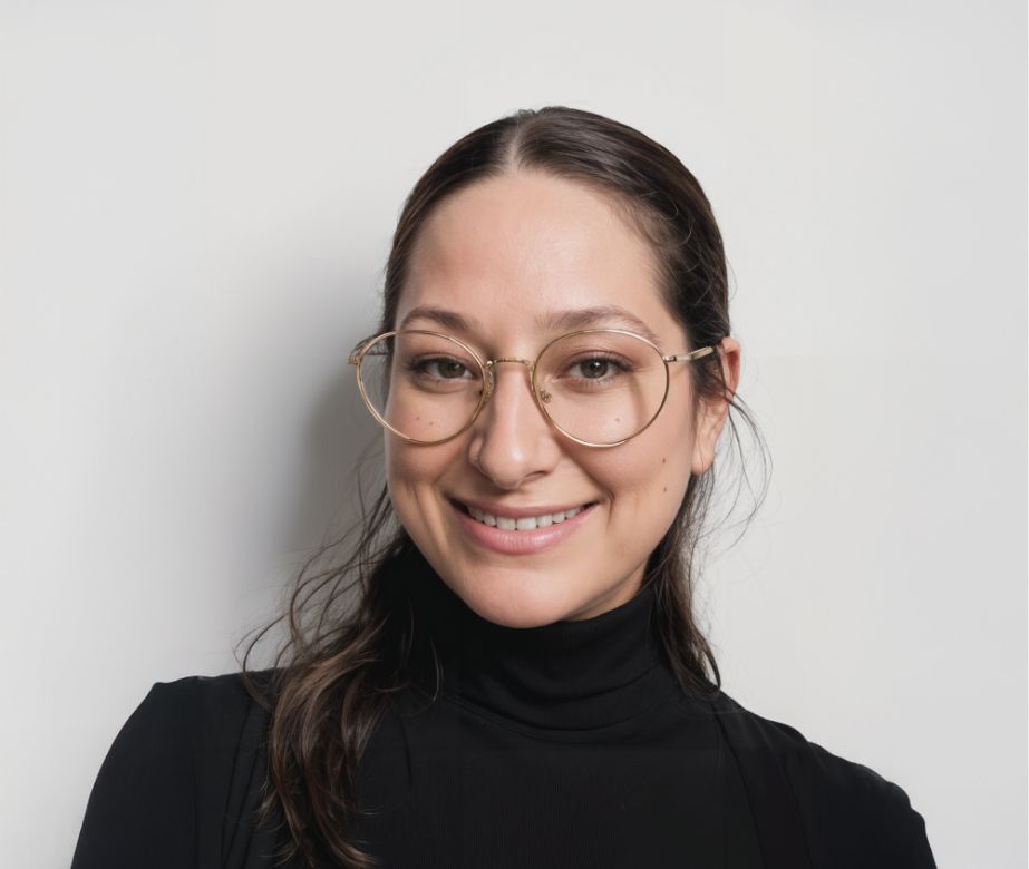 Photo of Cassie Modica, in a black turtleneck top wearing glasses.